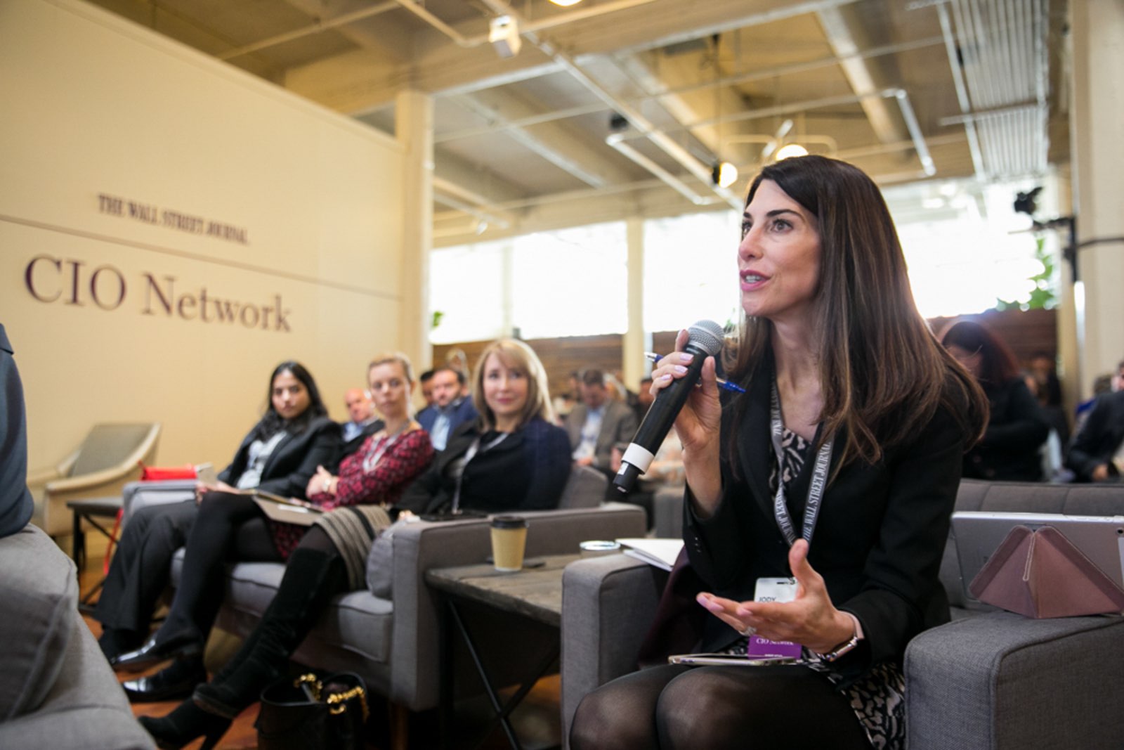 woman-speaking-at-wsj-cio-network-conference Conference